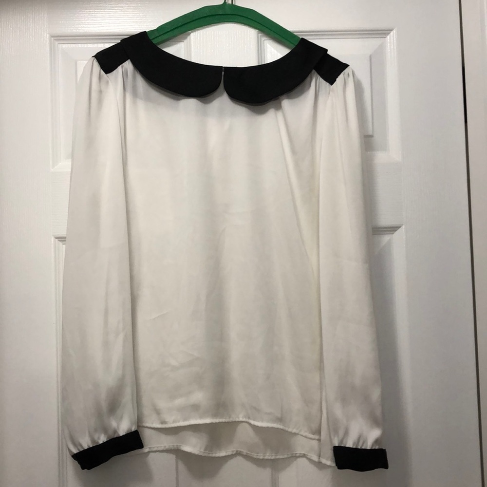 White blouse with black trim